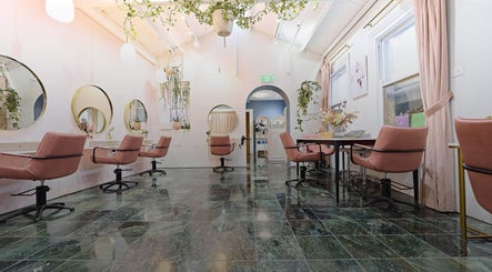 Elegant seating at Roshy Eyelash Extensions & Brows Norwest, Baulkham Hills, New South Wales, AU with pink chairs.