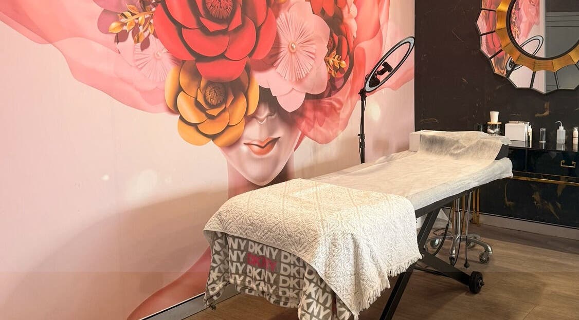 Massage table at Roshy Eyelash Extensions & Brows Norwest, Baulkham Hills, New South Wales, AU with floral decor.