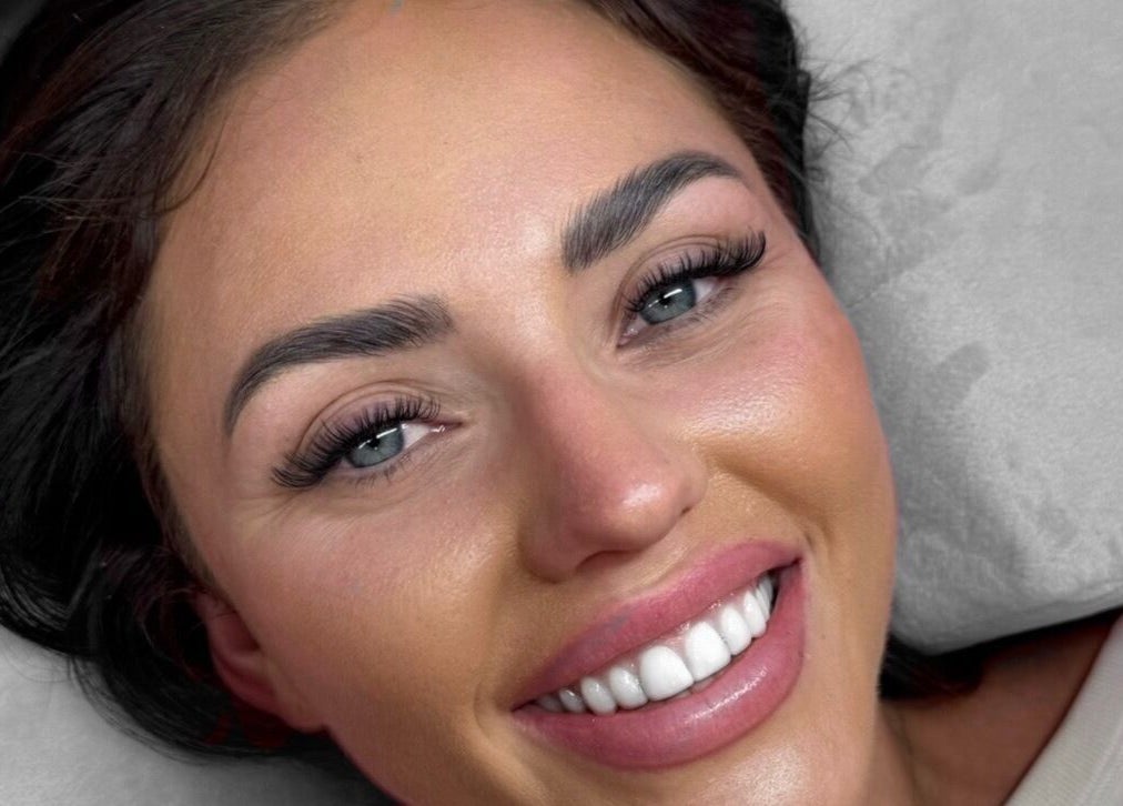 Close-up of a smiling woman with enhanced lashes at Fabulash, Burleigh Waters, Queensland, AU.