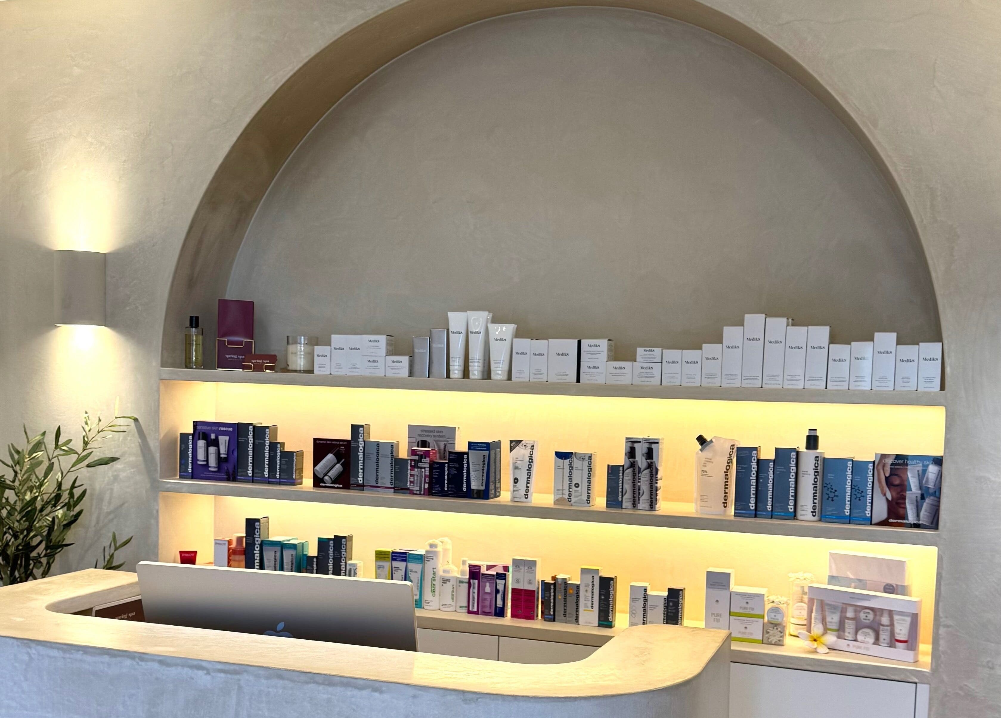 Reception area of Fabulash, Burleigh Waters, Queensland, AU, with skincare products displayed on shelves.