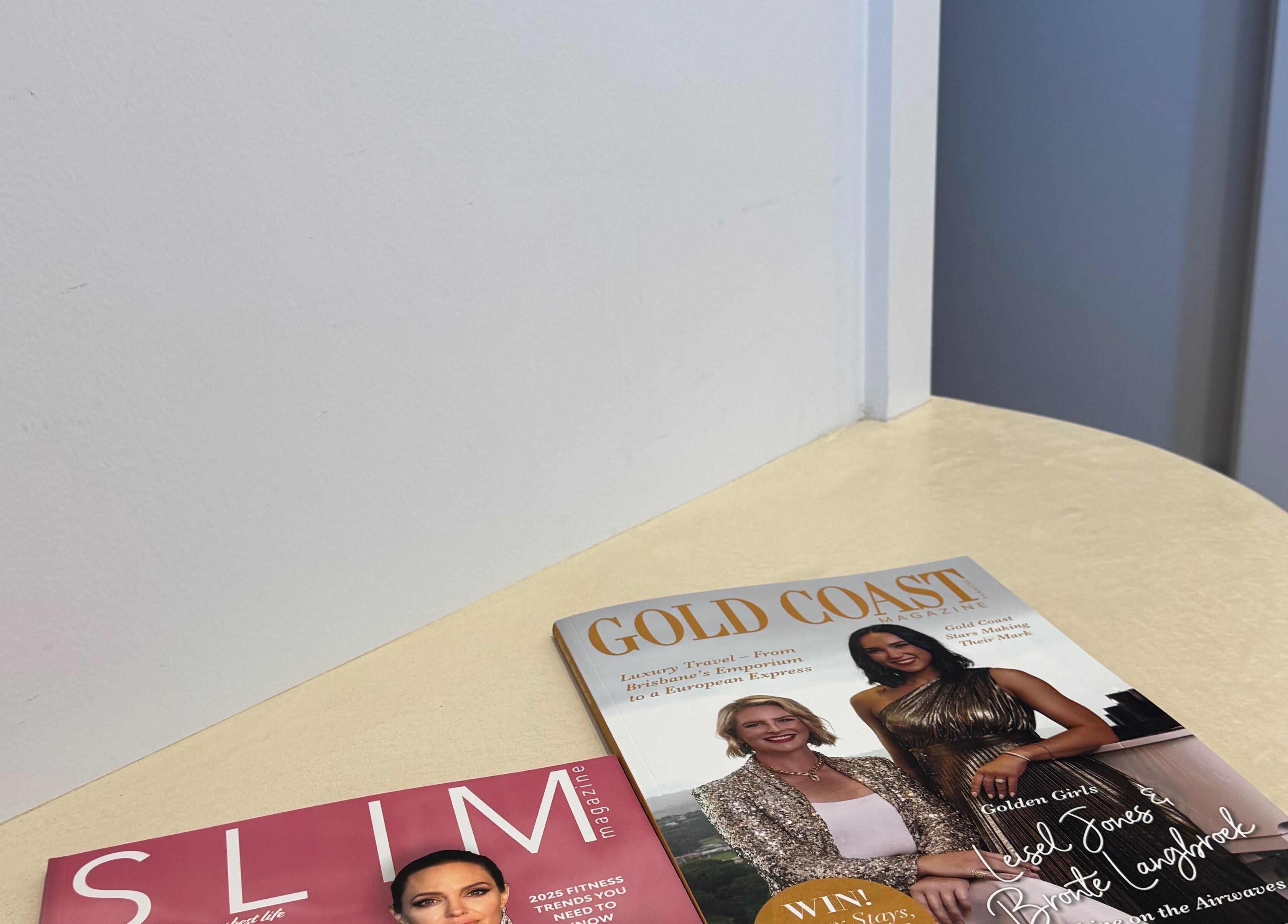 Magazines on a table at Fabulash, Burleigh Waters, Queensland, AU highlighting relaxation and style.