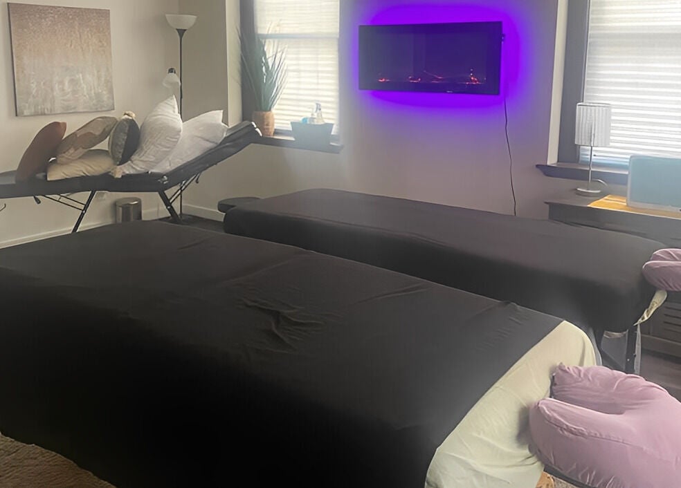 Relaxing massage room at New Beginnings Spa Services, Lansing, Michigan, US with calming ambiance.