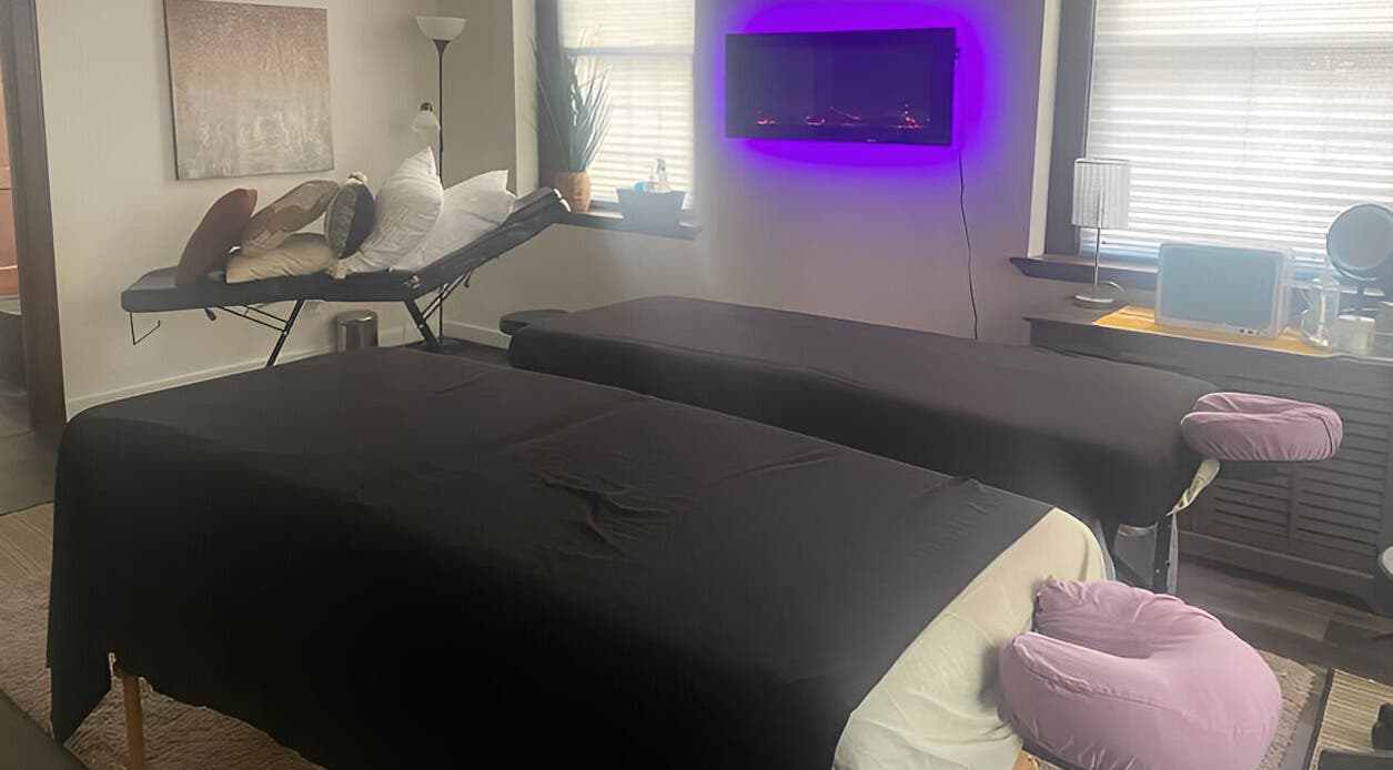 Relaxing massage room at New Beginnings Spa Services, Lansing, Michigan, US with calming ambiance.
