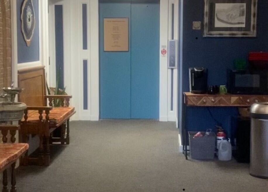 Inviting hallway at New Beginnings Spa Services in Lansing, Michigan, US, showcasing serene decor and cozy seating.