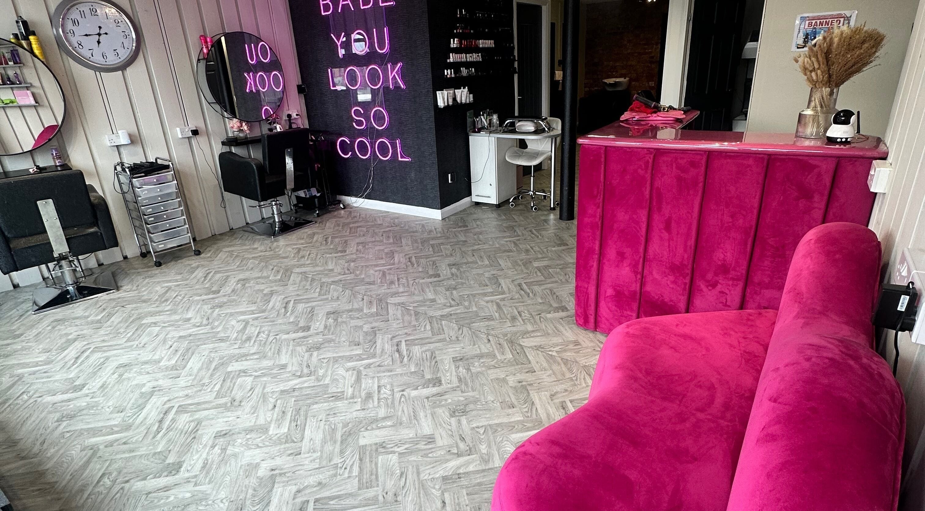 Vibrant pink interior of Forbidden Beauty Limited salon in Coalville, England, GB with modern decor.