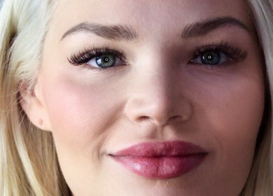 Close-up of woman's radiant face showcasing beauty at BRYA Beauty, Coquitlam, British Columbia, CA.