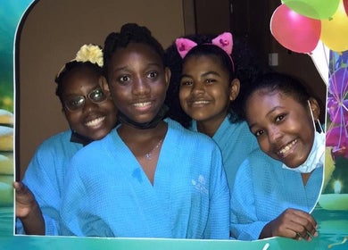 Smiling group in blue robes at Blue Lotus Spa Gablewoods Mall, Sunny Acres, Castries, Castries, LC.