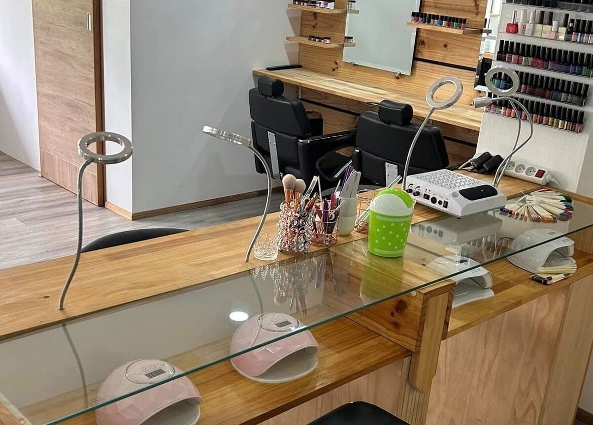 Modern nail salon station at Cosmetic Island Port Louis, Port Louis District, MU with manicure tools and seating.