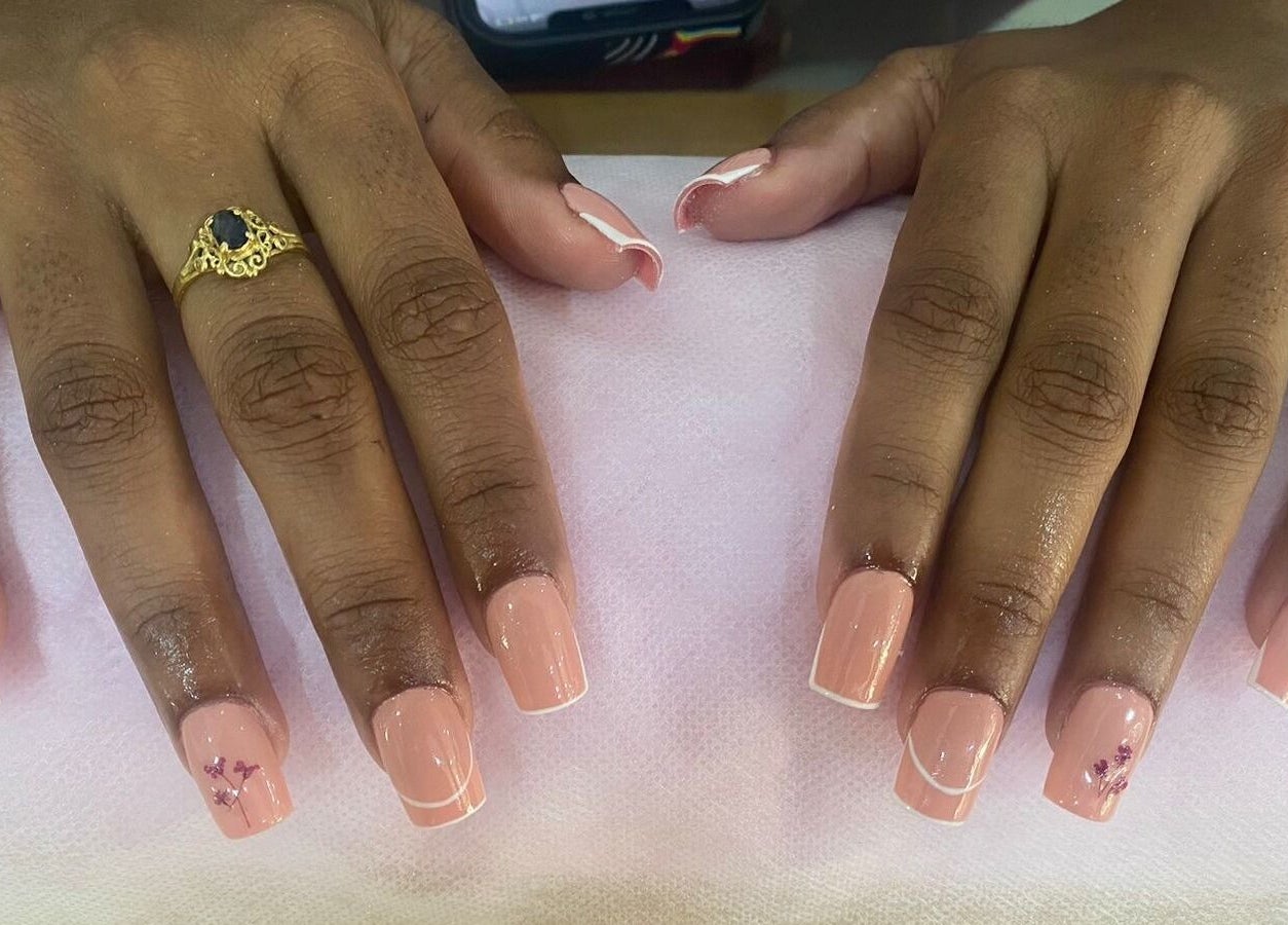 Elegant nail art with peach polish at Cosmetic Island Port Louis, Port Louis District, MU.