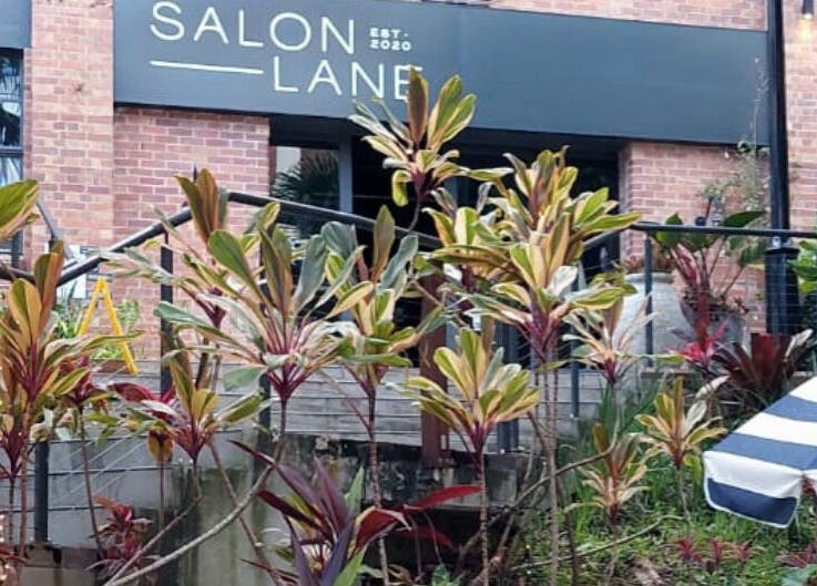 Exterior of Reset With Khloe at West End, Queensland, AU with lush plants and a stylish entrance.