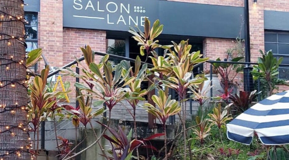 Exterior of Reset With Khloe at West End, Queensland, AU with lush plants and a stylish entrance.