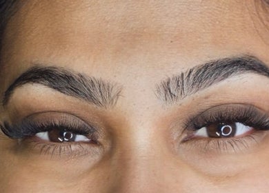 Close-up of expertly styled eyebrows and lashes at Inv Beauty Bar, Toronto, Ontario, CA.