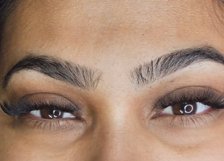 Close-up of perfectly shaped brows and lashes at Inv Beauty Bar in Toronto, Ontario, CA.