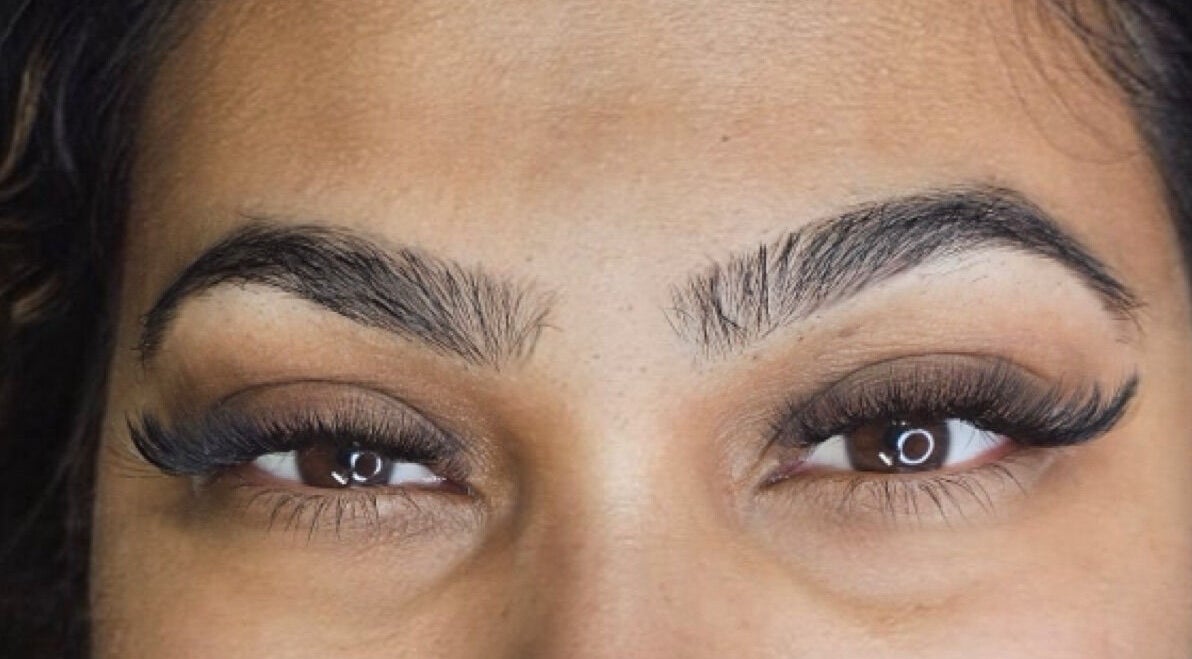 Close-up of perfectly shaped brows and lashes at Inv Beauty Bar in Toronto, Ontario, CA.