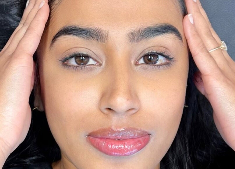 Relaxed woman enjoying a beauty treatment at Inv Beauty Bar, Toronto, Ontario, CA, highlighting skin health.