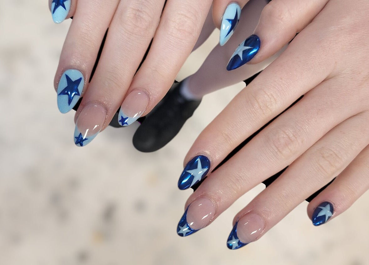 Stylish star-themed blue nail art at Hey Nails by Winn in Benowa, Queensland, AU.