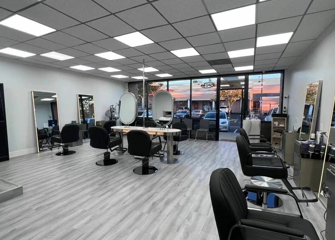 Modern and chic interior of K MA Salon Convoy in San Diego, California, US, featuring sleek styling stations.