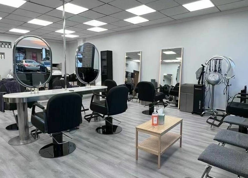 Modern interior of K MA Salon Convoy, San Diego, California, US, featuring styling chairs and sleek mirrors.