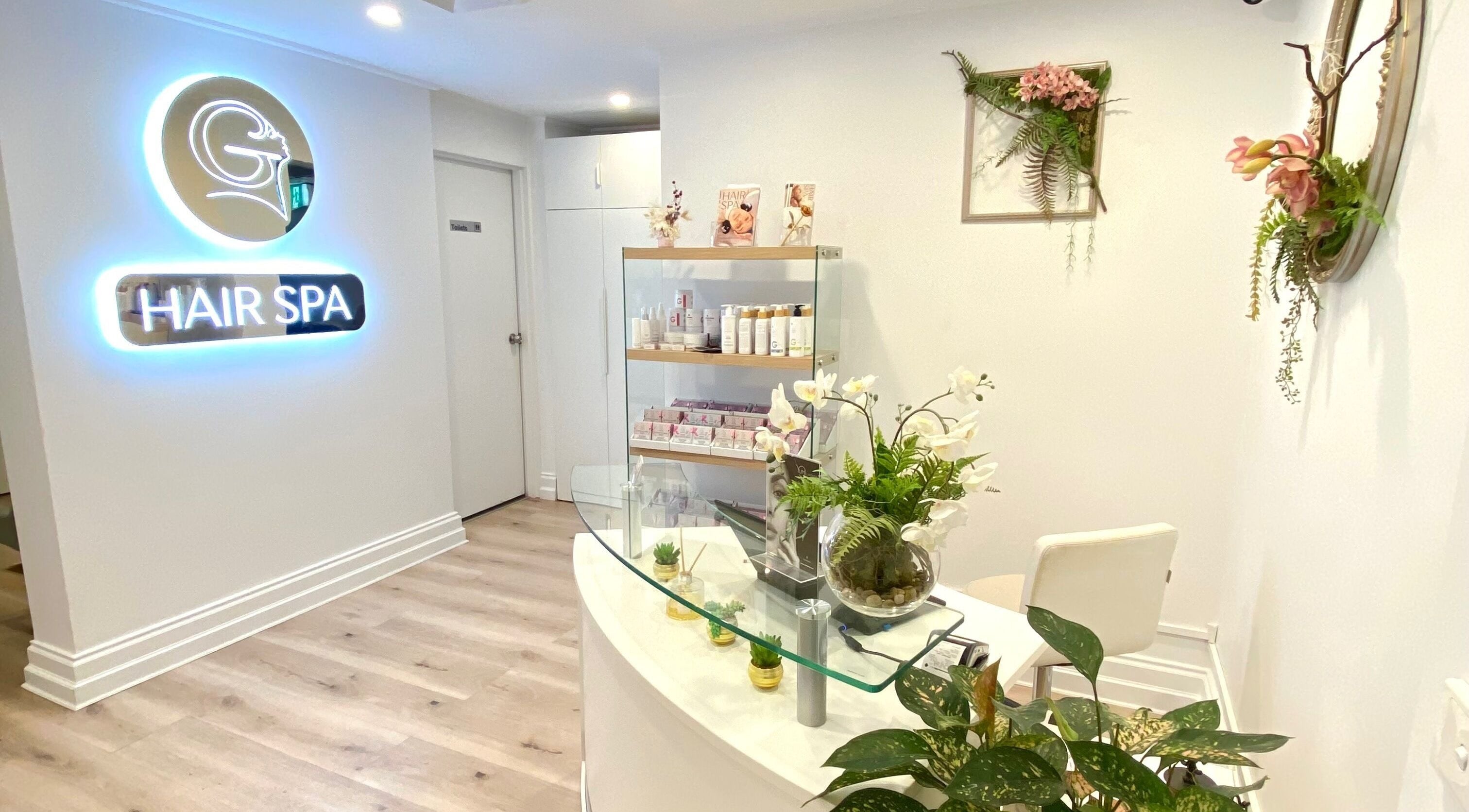 Reception area of Hair Spa Melbourne featuring stylish decor and beauty products at Melbourne, Victoria, AU.