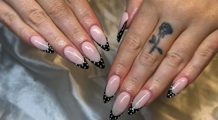 Stylish black and pink nail design at CW and Co, Melbourne, Victoria, AU, showcasing intricate detailing.