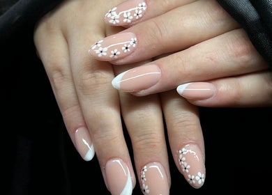 Elegant French manicure with floral designs at Lux Nails, Galway, County Galway, IE.