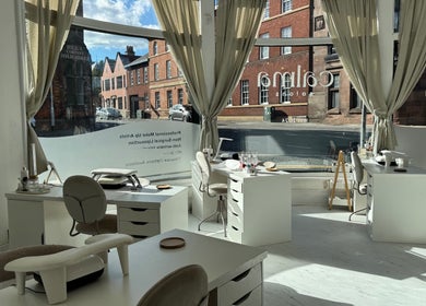 Bright interior of Calma Salons- Altrincham, showcasing elegant nail stations in Altrincham, England, GB.