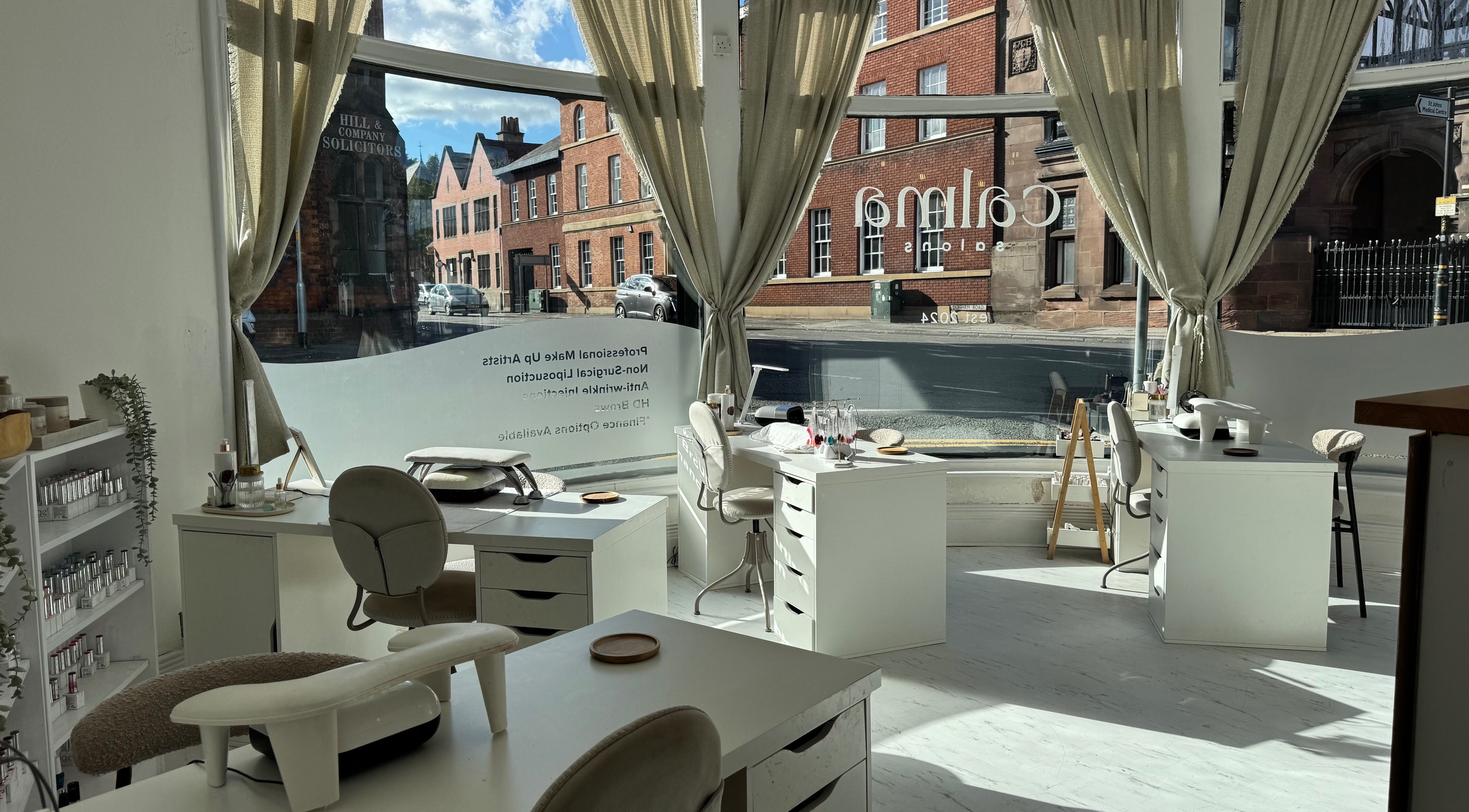 Bright interior of Calma Salons- Altrincham, showcasing elegant nail stations in Altrincham, England, GB.