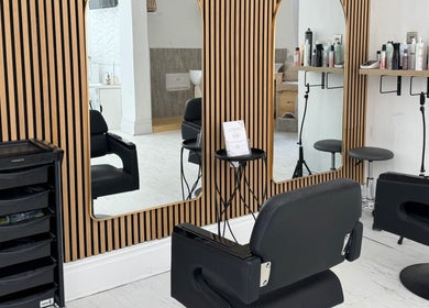 Modern salon interior at Calma Salons- Altrincham, featuring stylish black chairs in Altrincham, England, GB.