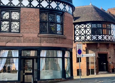 Calma Salons- Altrincham, a historic building in Altrincham, England, GB with beautiful black and white accents.