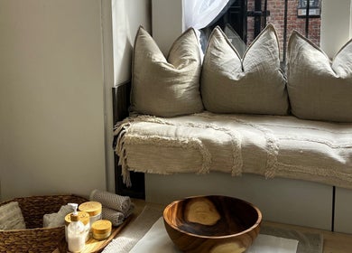 Tranquil seating area with cushions at Calma Salons- Altrincham, Altrincham, England, GB.