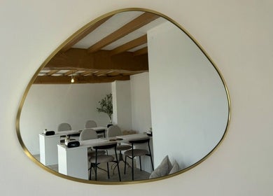 Interior of Calma Salons - Chester, showcasing a sleek mirrored wall in Chester, England, GB.
