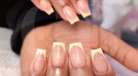 Close-up of elegant French manicure at Cherry Blossom, Gönyeli, TR, showcasing glossy finish.