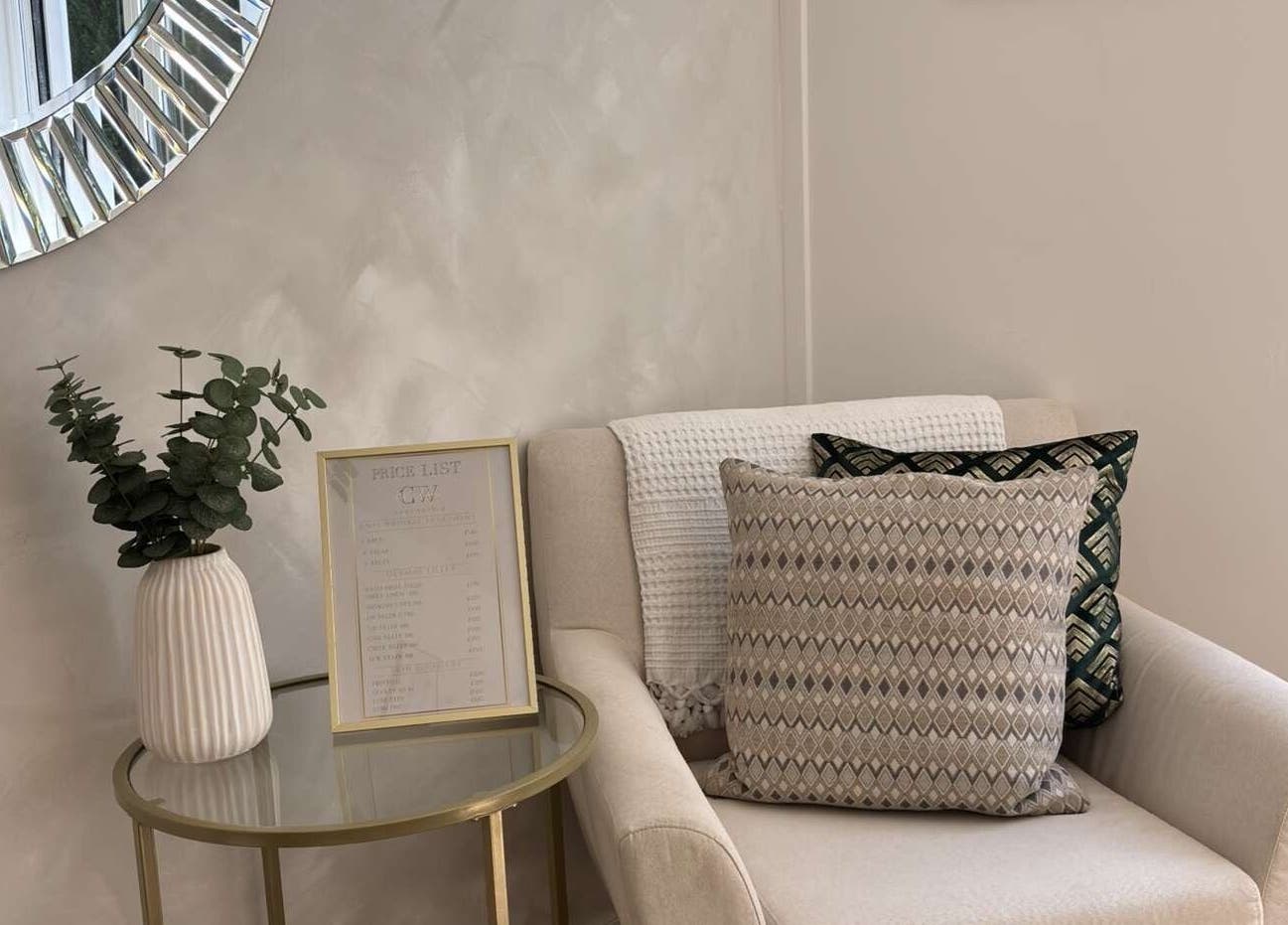 Comfortable seating with tasteful decor at Cw Aesthetics, Bryncethin, Wales, GB, highlighting a tranquil ambiance.