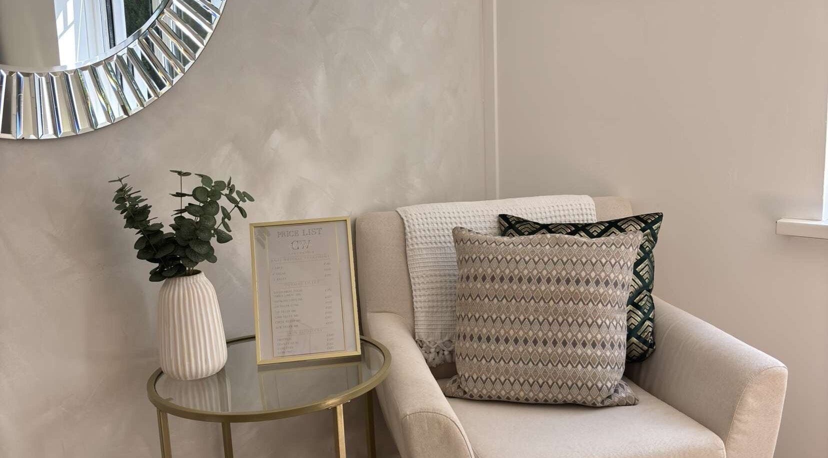 Comfortable seating with tasteful decor at Cw Aesthetics, Bryncethin, Wales, GB, highlighting a tranquil ambiance.