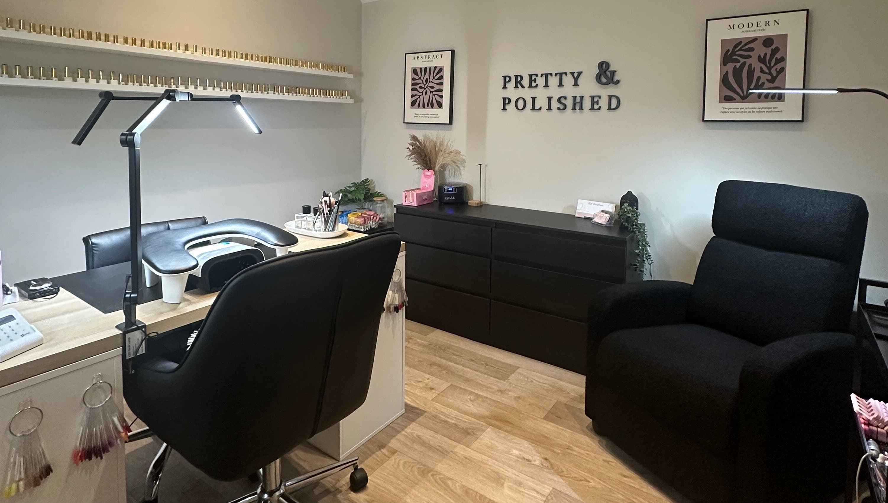 Elegant nail salon setup at Pretty and Polished, Sandy, England, GB, featuring a manicure station and cozy seating.