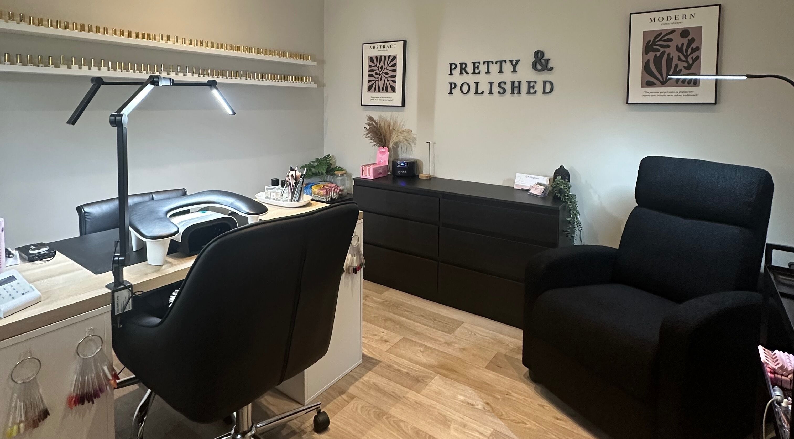 Elegant nail salon setup at Pretty and Polished, Sandy, England, GB, featuring a manicure station and cozy seating.