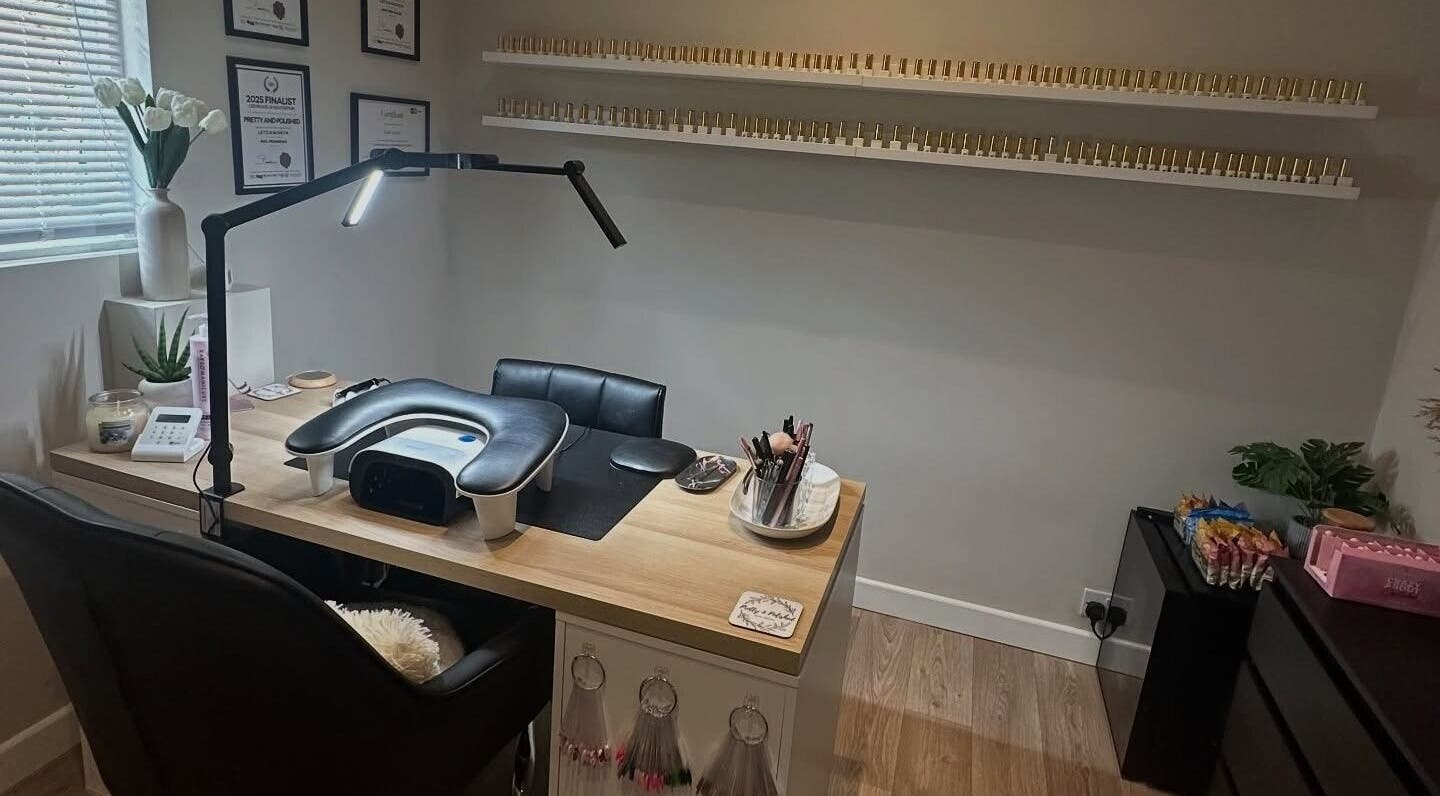 Modern nail desk at Pretty and Polished in Sandy, England, GB, showcasing tools and decor.