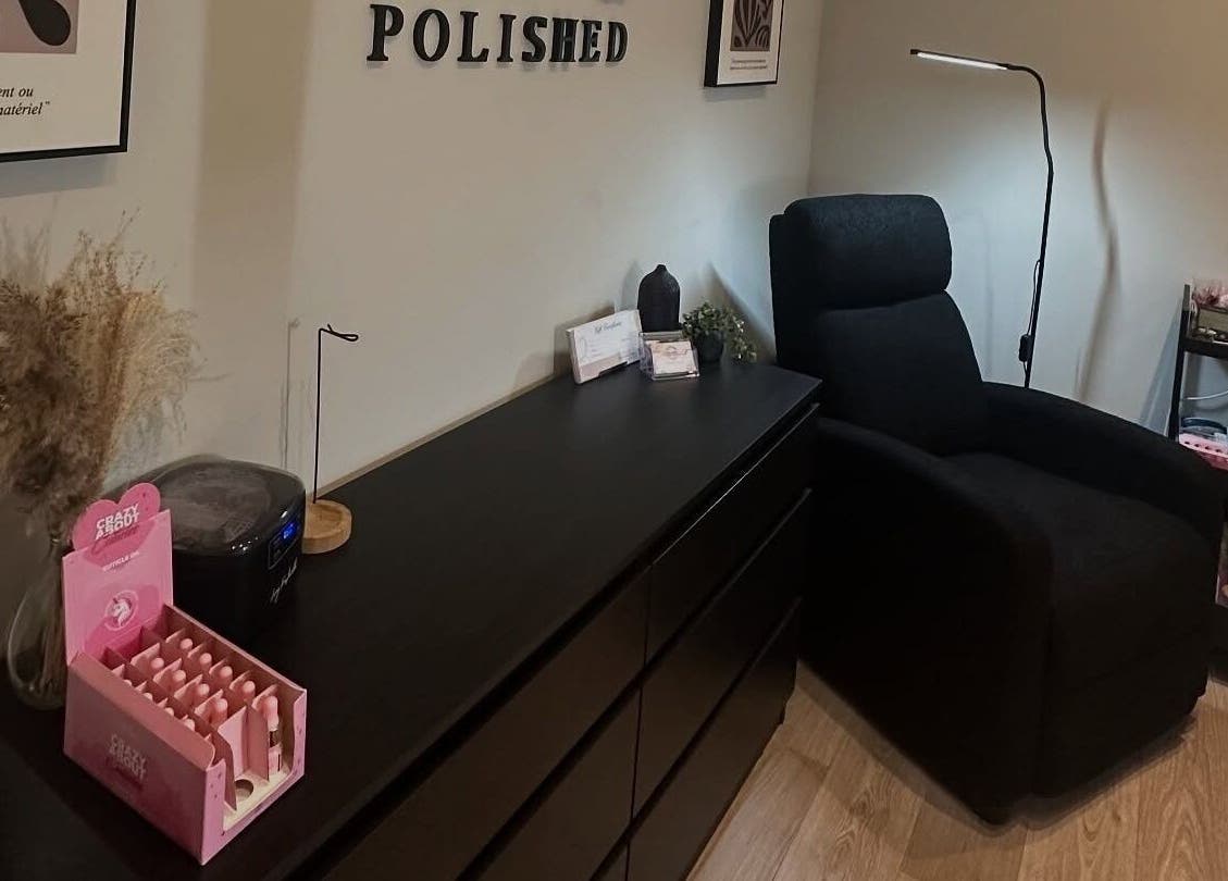 Tranquil beauty corner at Pretty and Polished, Sandy, England, GB with cozy chair and elegant decor.