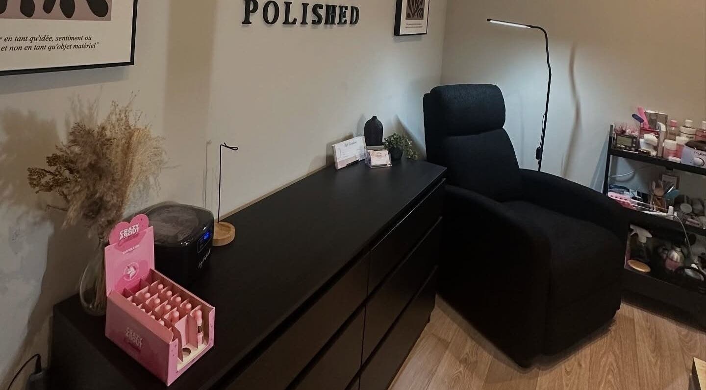 Tranquil beauty corner at Pretty and Polished, Sandy, England, GB with cozy chair and elegant decor.