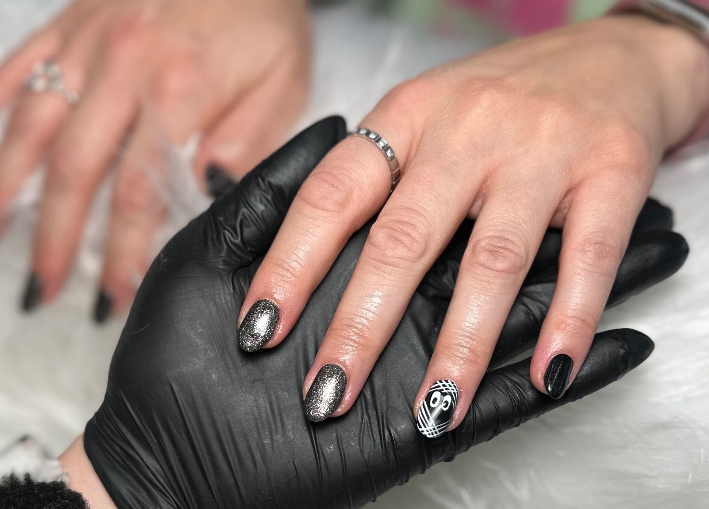 Manicure with black and silver nails at Pretty and Polished, Sandy, England, GB.
