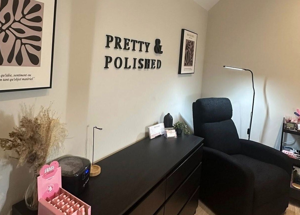 Cozy treatment room at Pretty and Polished in Sandy, England, GB with a recliner and treatment products.