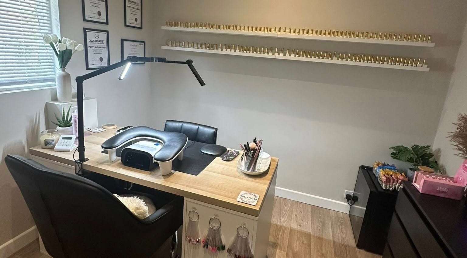 Pretty and Polished's elegant nail station in Sandy, England, GB, featuring nail tools and serene decor.