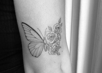 Butterfly and rose tattoo on arm at Cosmetic Artistry by Letitia in Brisbane, Queensland, AU.