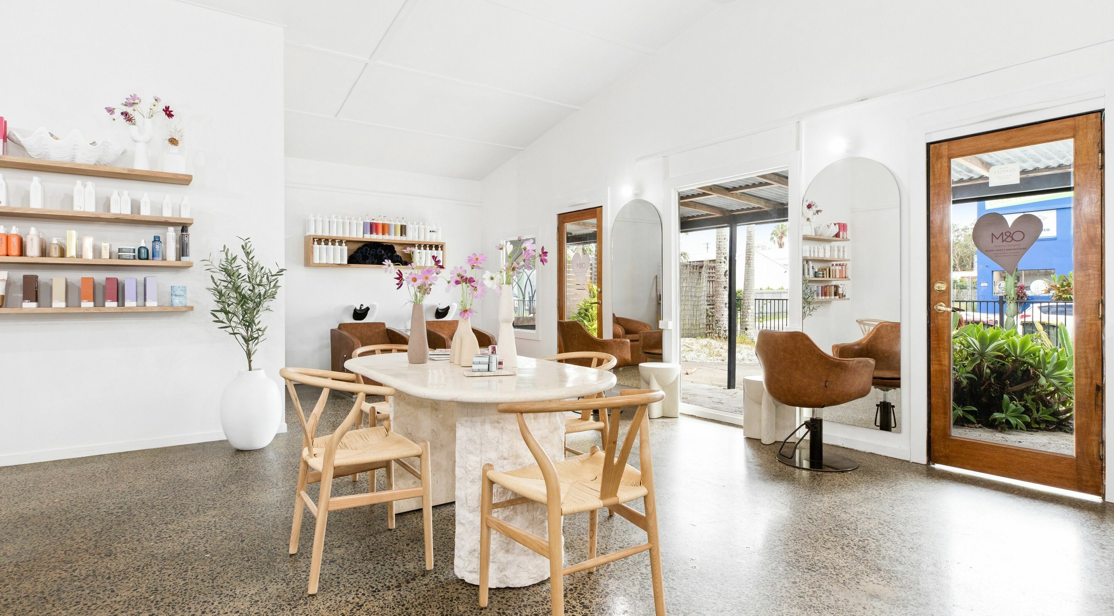 Chic interior of Mer-a-ki hair studio in Byron Bay, NSW, AU with stylish decor and seating area.
