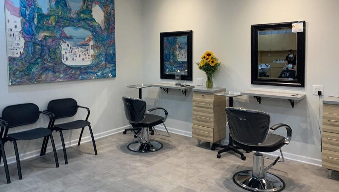 Gemini Hair Studio in Randolph, New Jersey offers stylish hairdressing stations with vibrant art decor.