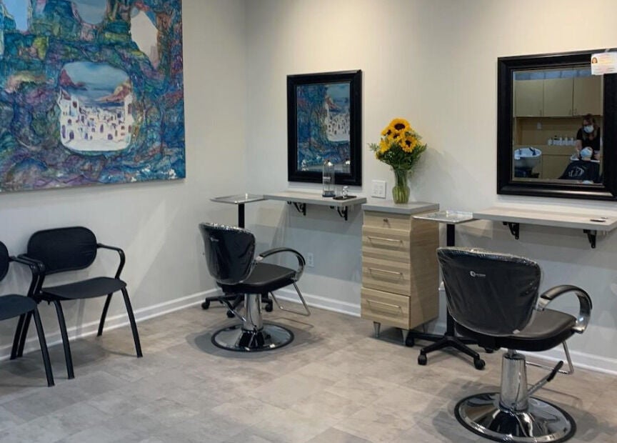 Gemini Hair Studio in Randolph, New Jersey offers stylish hairdressing stations with vibrant art decor.