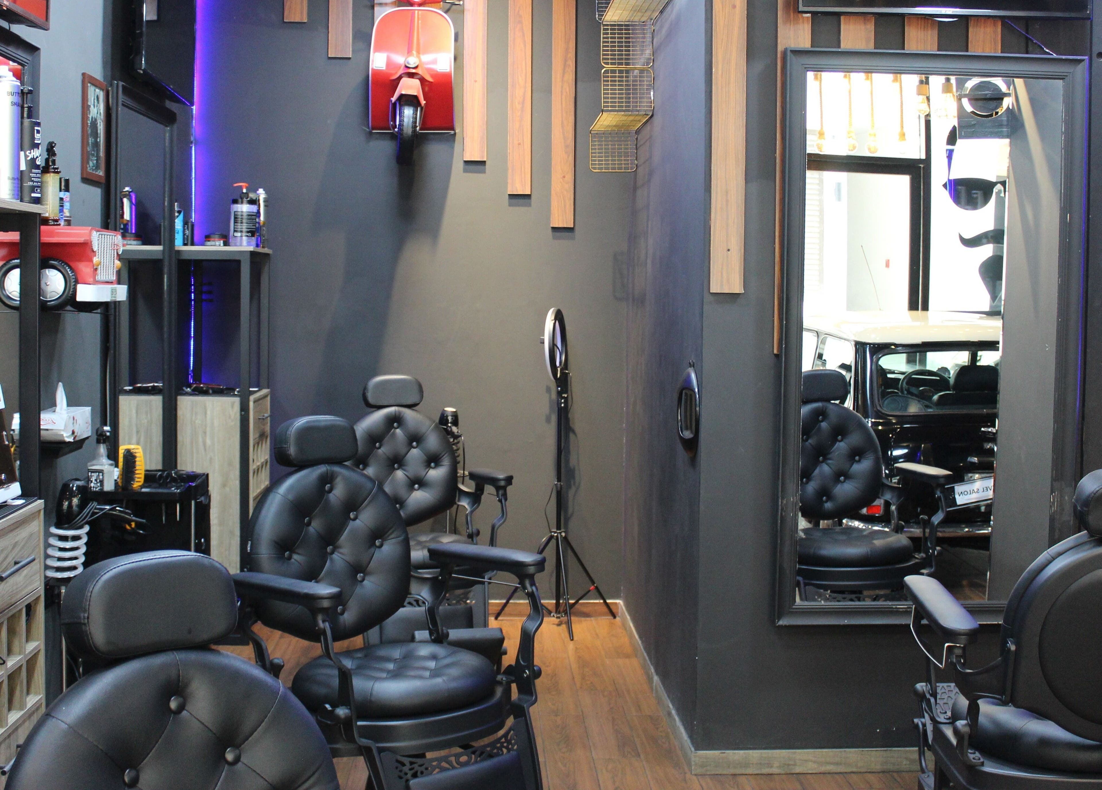 Modern interior at Black Level Gent's Salon, Dubai, Dubai, AE, featuring stylish barber chairs and decor.