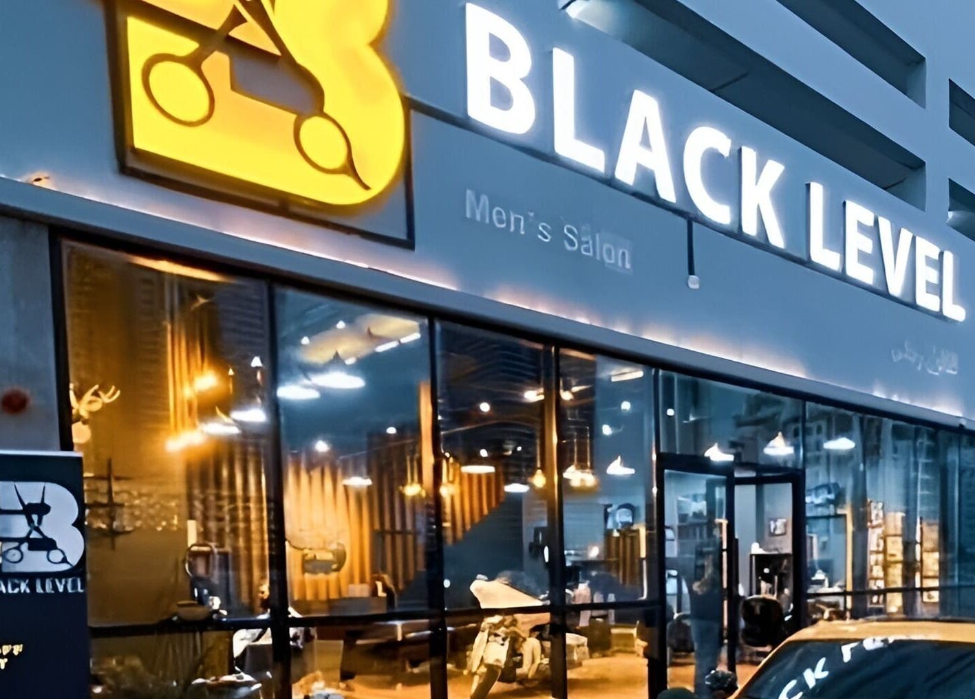 Black Level Gent's Salon entrance with vibrant signage in Dubai, Dubai, AE.
