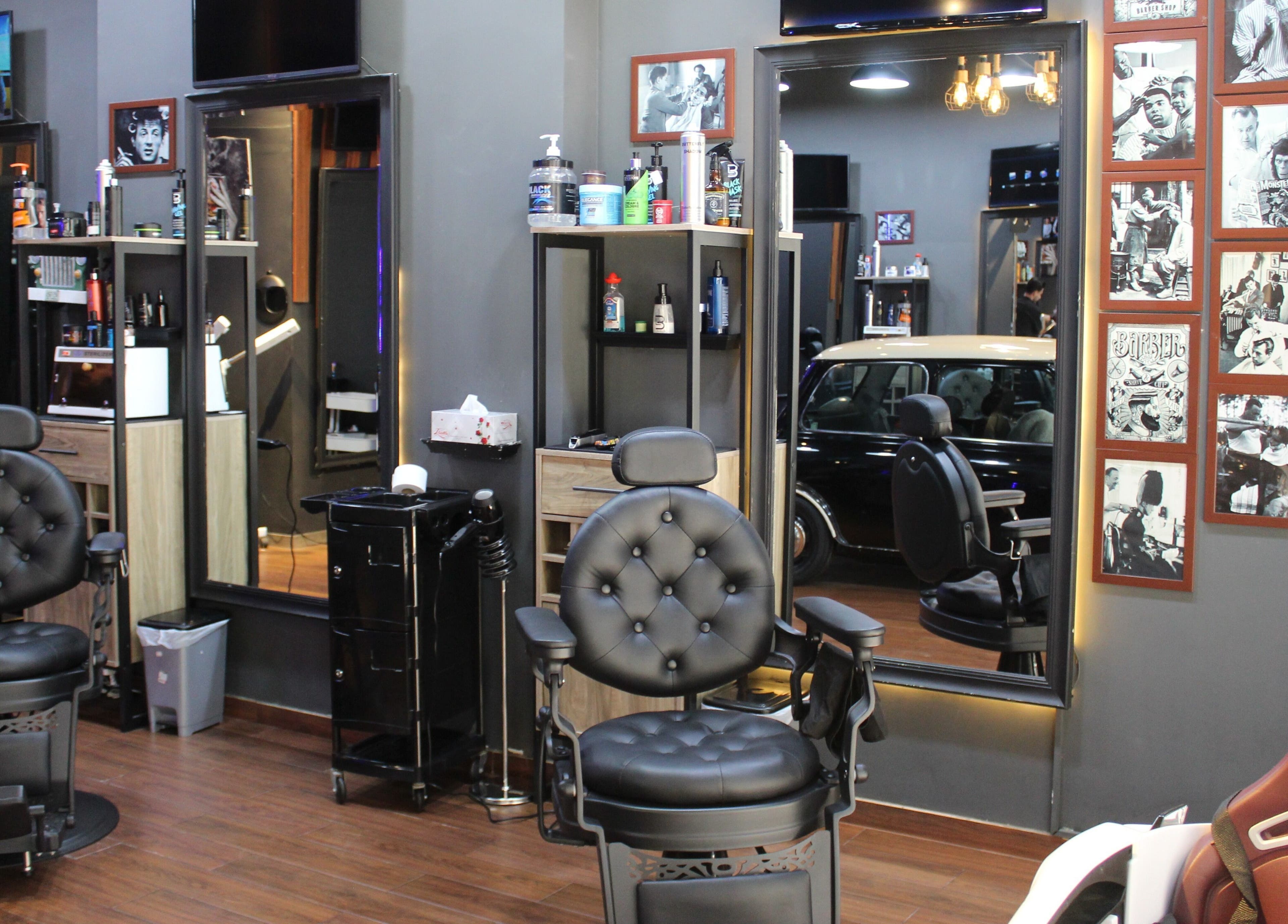 Interior of Black Level Gent's Salon in Dubai, Dubai, AE, featuring classic barber chairs and grooming tools.
