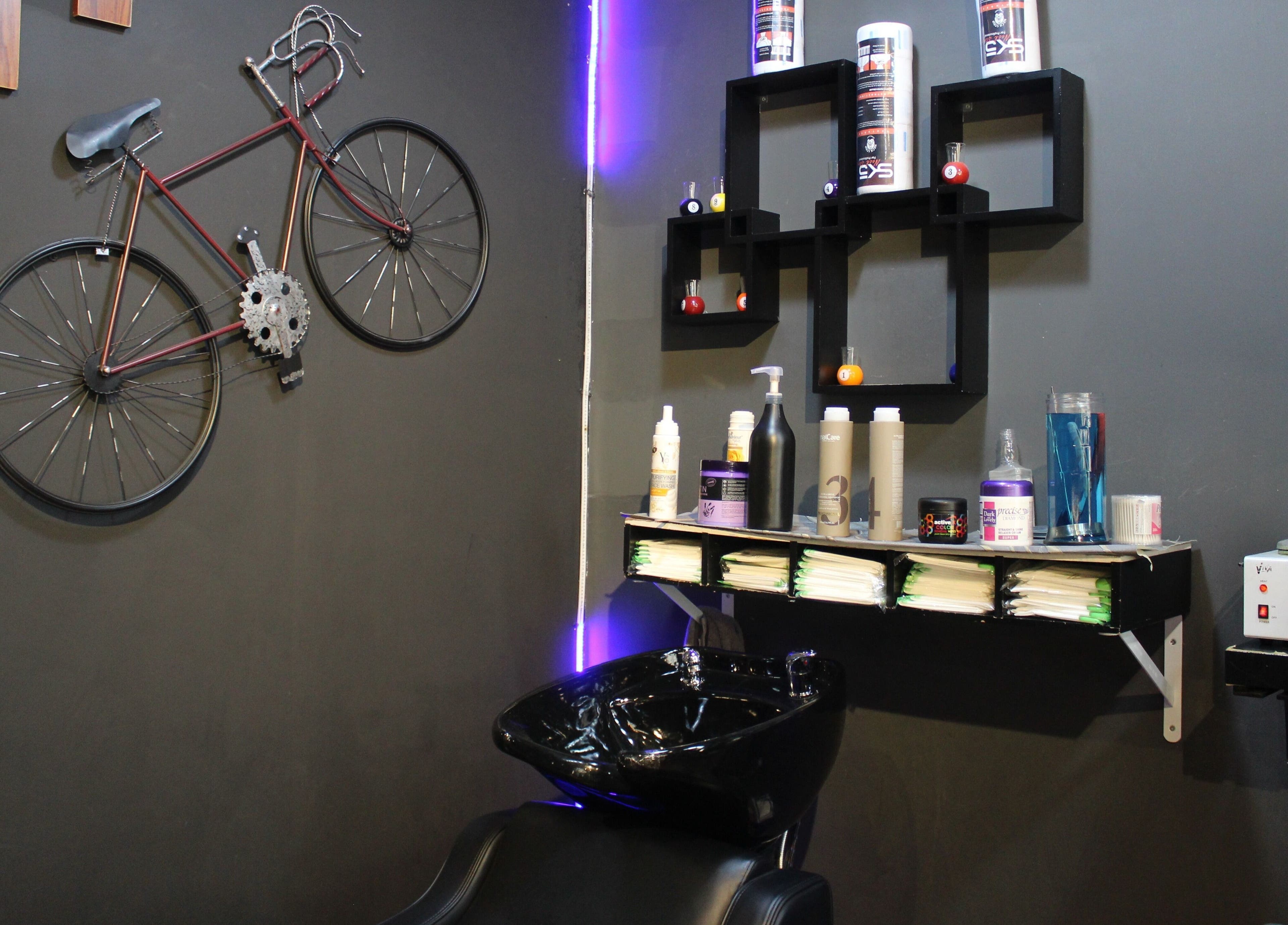 Modern salon setup with bicycle decor at Black Level Gent's Salon in Dubai, Dubai, AE.